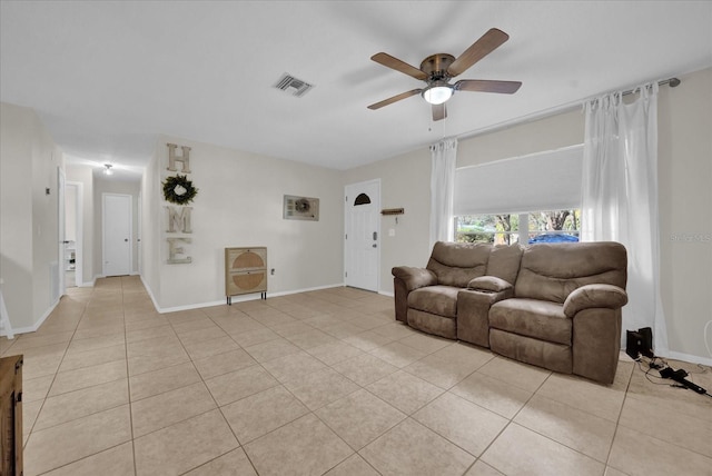 living room featuring light tile patterned floors and ceiling fan