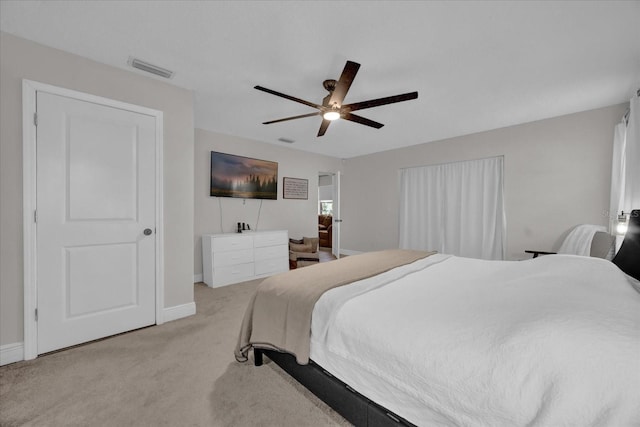 bedroom featuring light carpet and ceiling fan