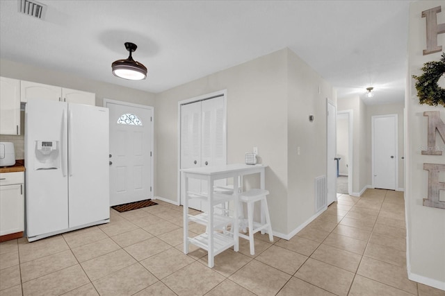 view of tiled foyer entrance