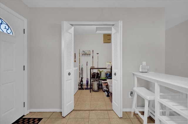 entrance foyer with light tile patterned floors