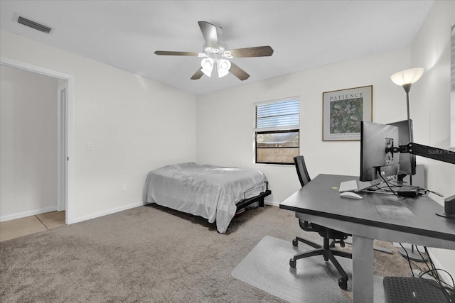 bedroom featuring ceiling fan and light carpet