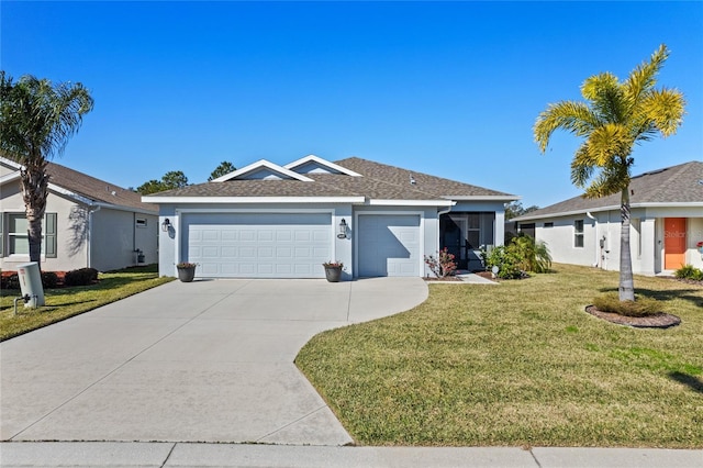 ranch-style house featuring a garage and a front lawn