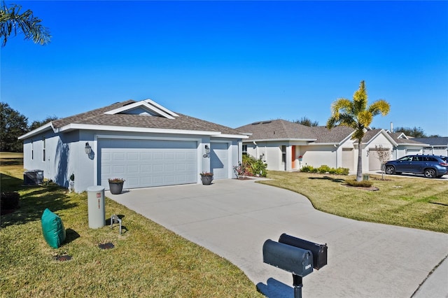 ranch-style house featuring a garage and a front yard