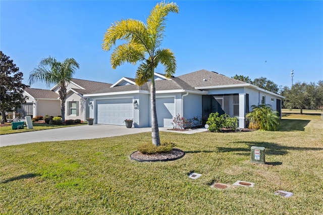 ranch-style house with a garage and a front lawn