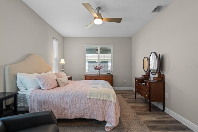 bedroom featuring ceiling fan and dark hardwood / wood-style flooring