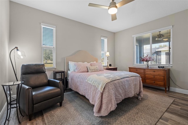 bedroom featuring dark hardwood / wood-style flooring and ceiling fan