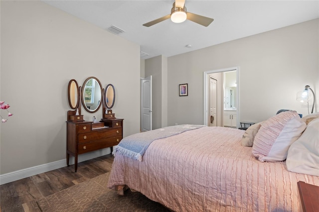 bedroom featuring dark wood-type flooring, ceiling fan, and ensuite bathroom