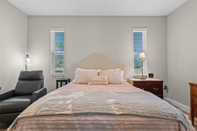 bedroom with hardwood / wood-style flooring