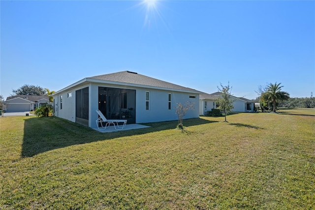 back of house featuring a yard