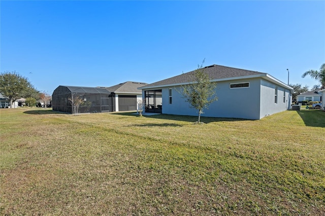 back of house with a lawn