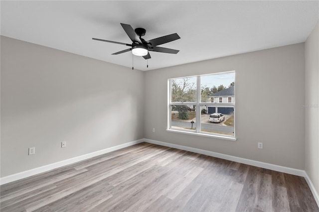 empty room featuring ceiling fan and light wood-type flooring