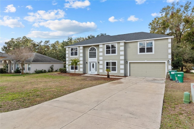 view of front of home featuring a garage and a front lawn