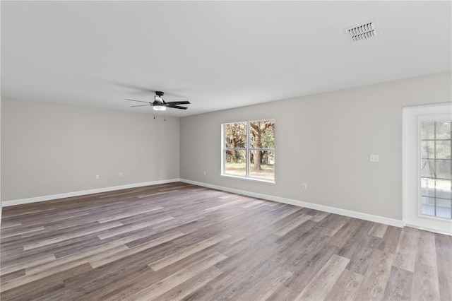 spare room with ceiling fan and light hardwood / wood-style flooring