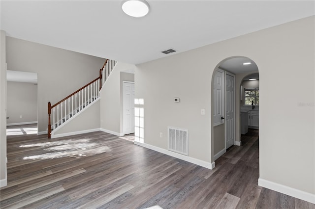 unfurnished room featuring dark hardwood / wood-style flooring