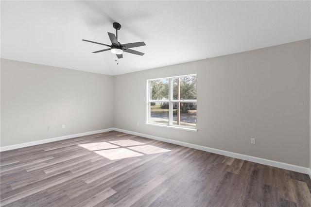 spare room with hardwood / wood-style flooring and ceiling fan