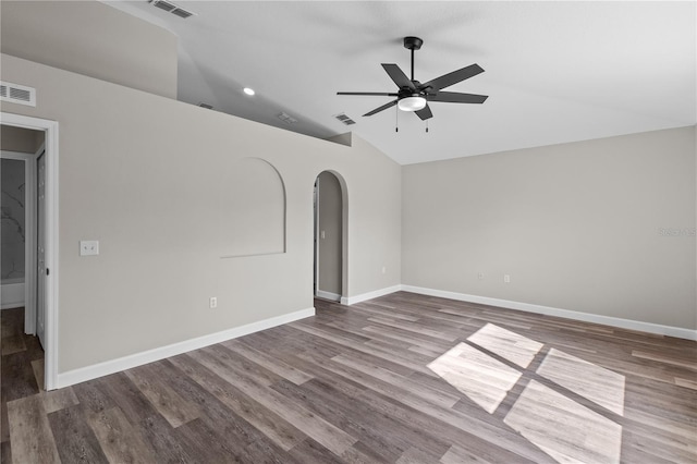 spare room featuring ceiling fan, vaulted ceiling, and hardwood / wood-style floors