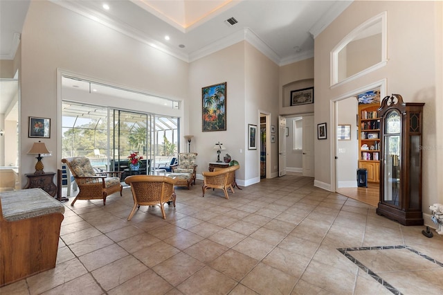 interior space featuring ornamental molding and a high ceiling