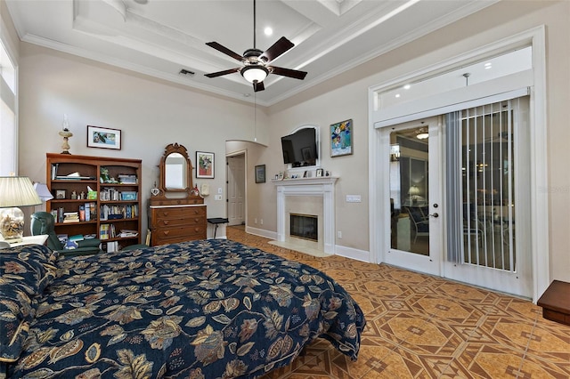 bedroom with ornamental molding and access to exterior