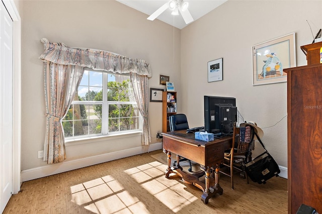 office area with light hardwood / wood-style flooring and ceiling fan