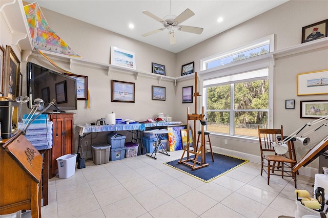 miscellaneous room with light tile patterned flooring and ceiling fan