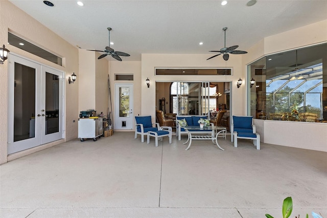 view of patio / terrace with an outdoor hangout area, french doors, ceiling fan, and glass enclosure