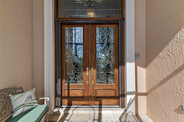 property entrance featuring french doors