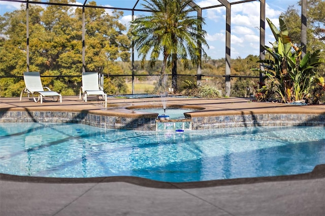 view of swimming pool with glass enclosure