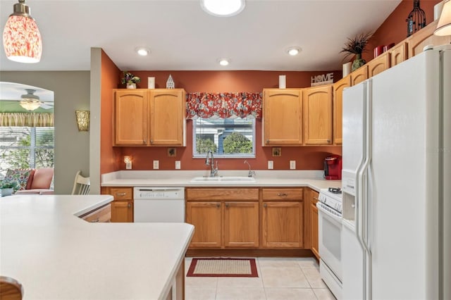 kitchen with light tile patterned flooring, pendant lighting, sink, ceiling fan, and white appliances