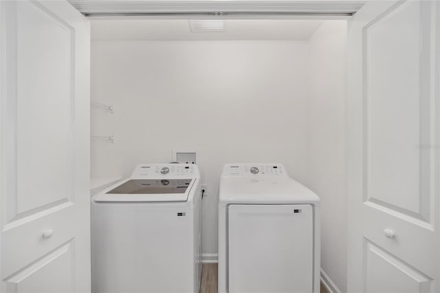 laundry room with washer and clothes dryer