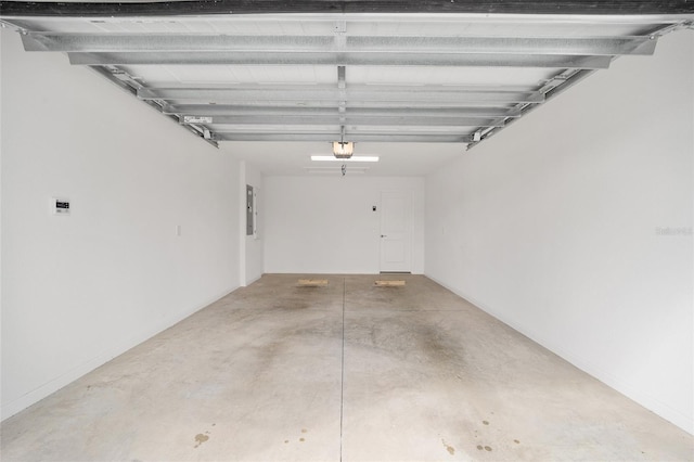 garage featuring a garage door opener and electric panel