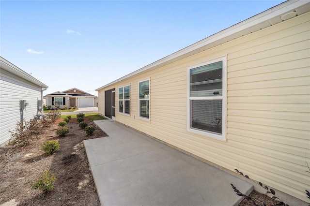 view of side of property with a garage