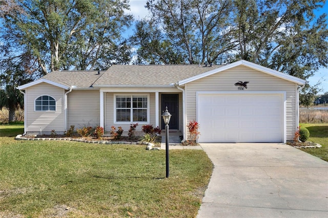 single story home featuring a garage and a front lawn