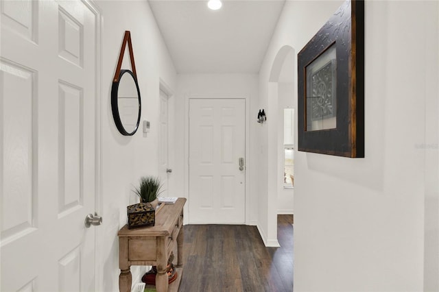 hallway with dark wood-type flooring