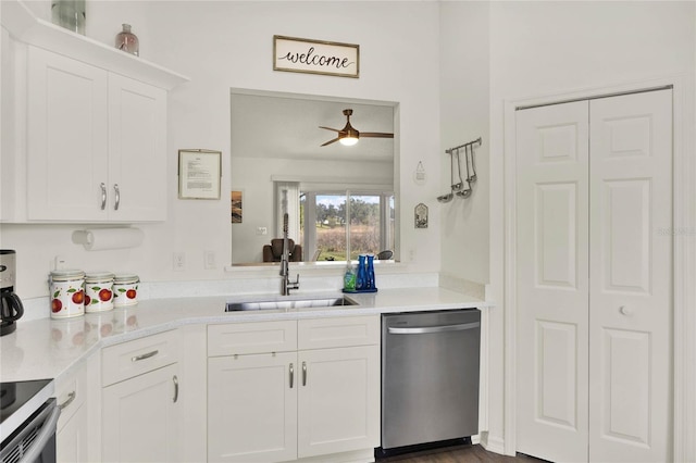 kitchen featuring sink, ceiling fan, white cabinetry, stove, and stainless steel dishwasher