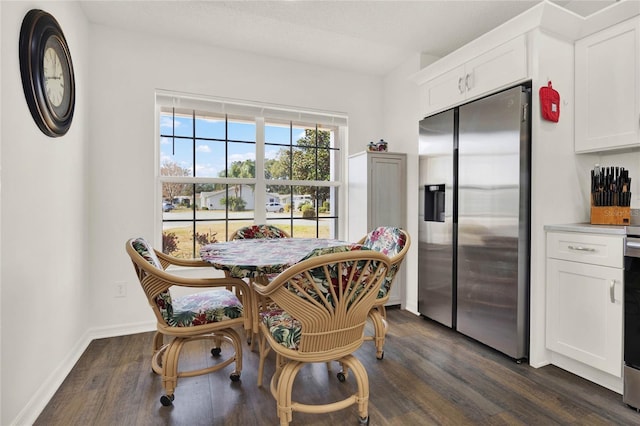 dining area featuring dark wood-type flooring