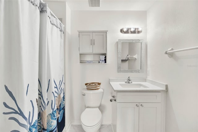 bathroom featuring walk in shower, vanity, and toilet