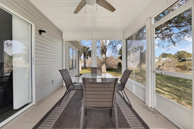 sunroom with a wealth of natural light and ceiling fan