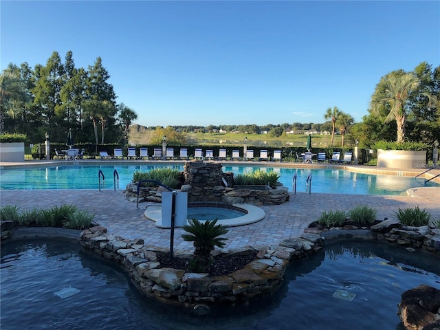 view of pool featuring a patio