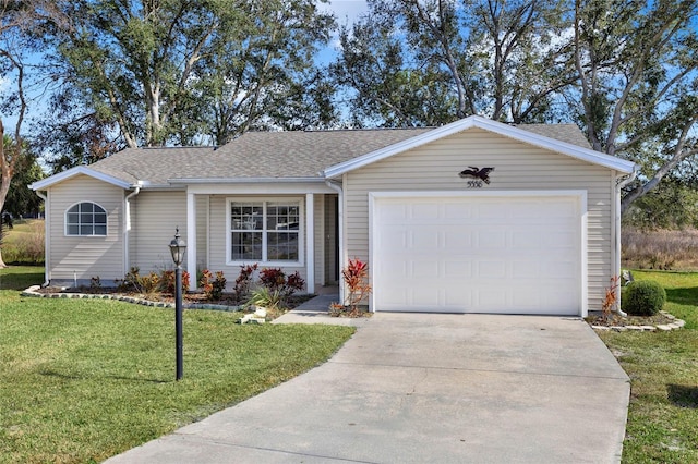 ranch-style house featuring a garage and a front lawn