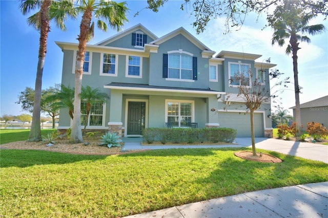 view of front facade with a garage and a front yard