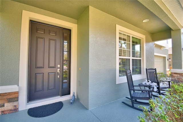 property entrance with covered porch