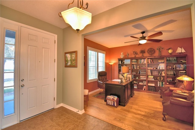 foyer entrance featuring hardwood / wood-style flooring and ceiling fan