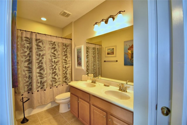 full bathroom featuring a textured ceiling, vanity, toilet, shower / bathtub combination with curtain, and tile patterned floors