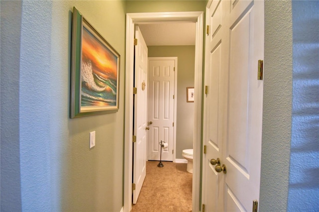 hallway with light tile patterned floors