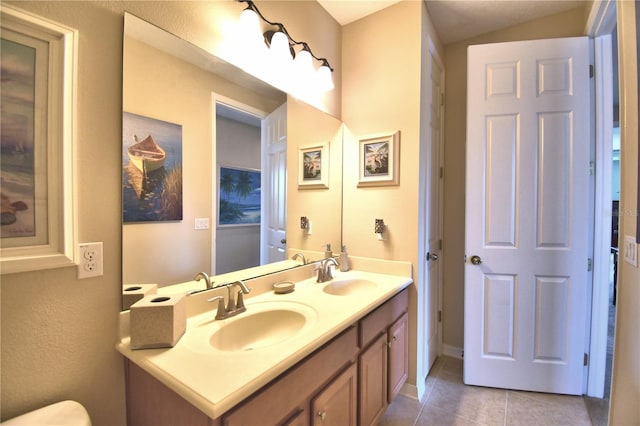 bathroom with vanity and tile patterned flooring