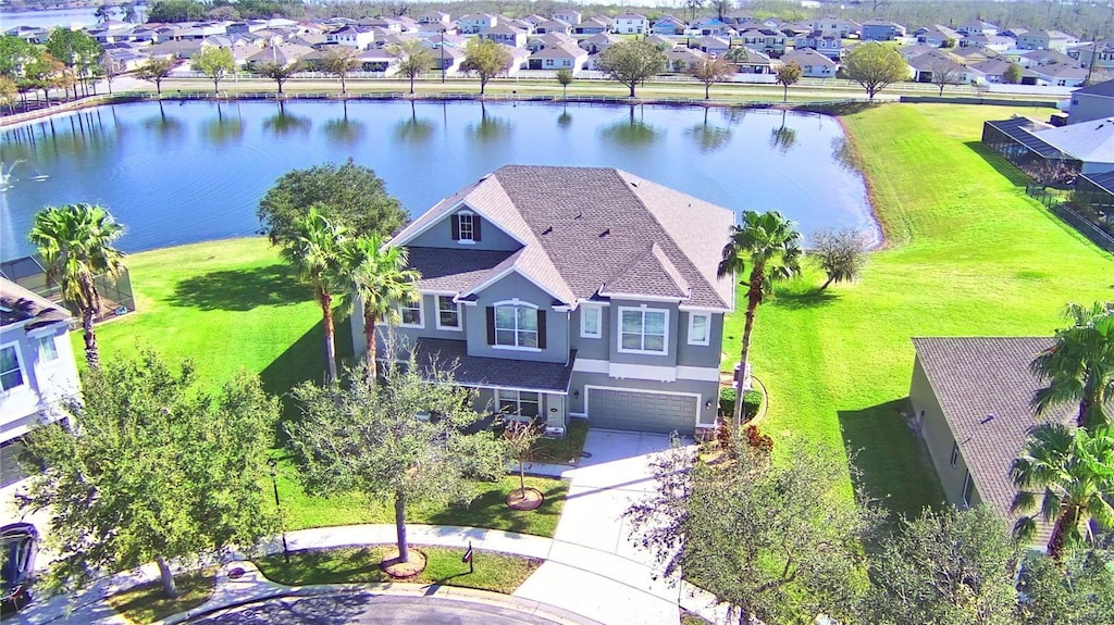 birds eye view of property featuring a water view