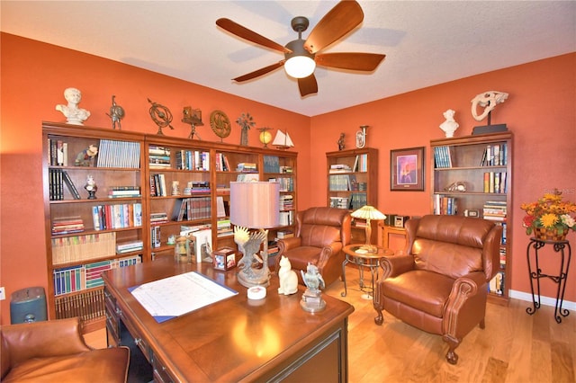 office area featuring ceiling fan and light hardwood / wood-style floors