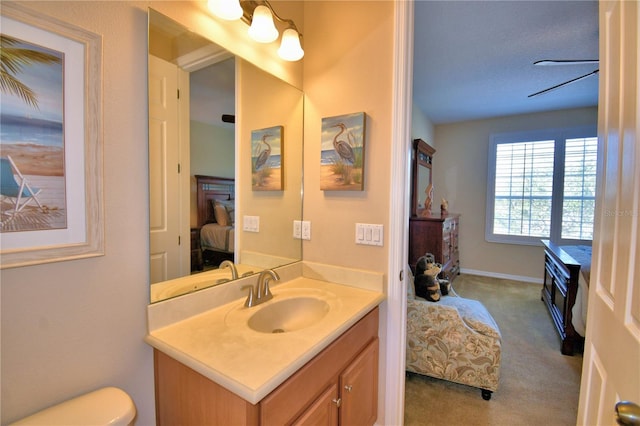 bathroom with vanity and toilet