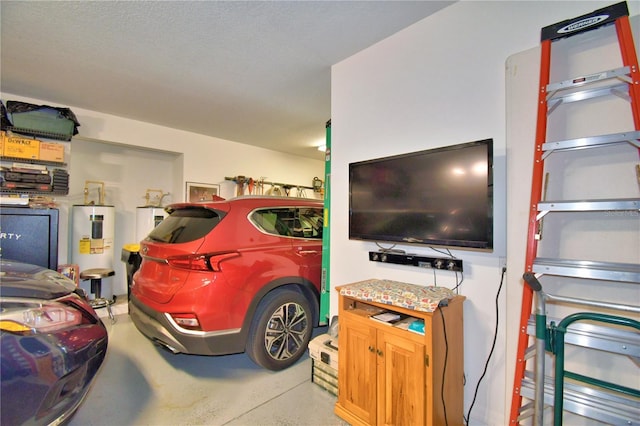 garage featuring electric water heater