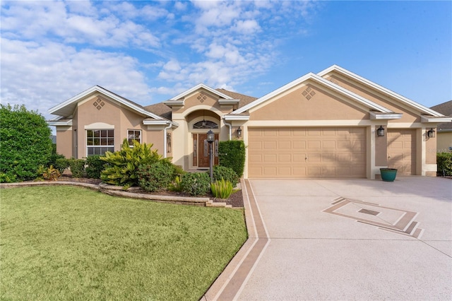 view of front of home featuring a garage and a front lawn